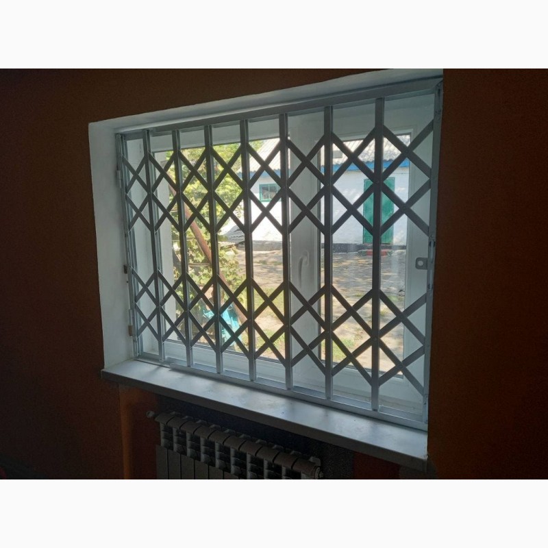 Фото 18. Раздвижные решетки металлические на окна, двери, витрины. Производство и установка Одесса